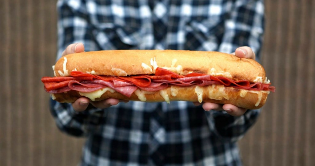 Person holding Subway Footlong