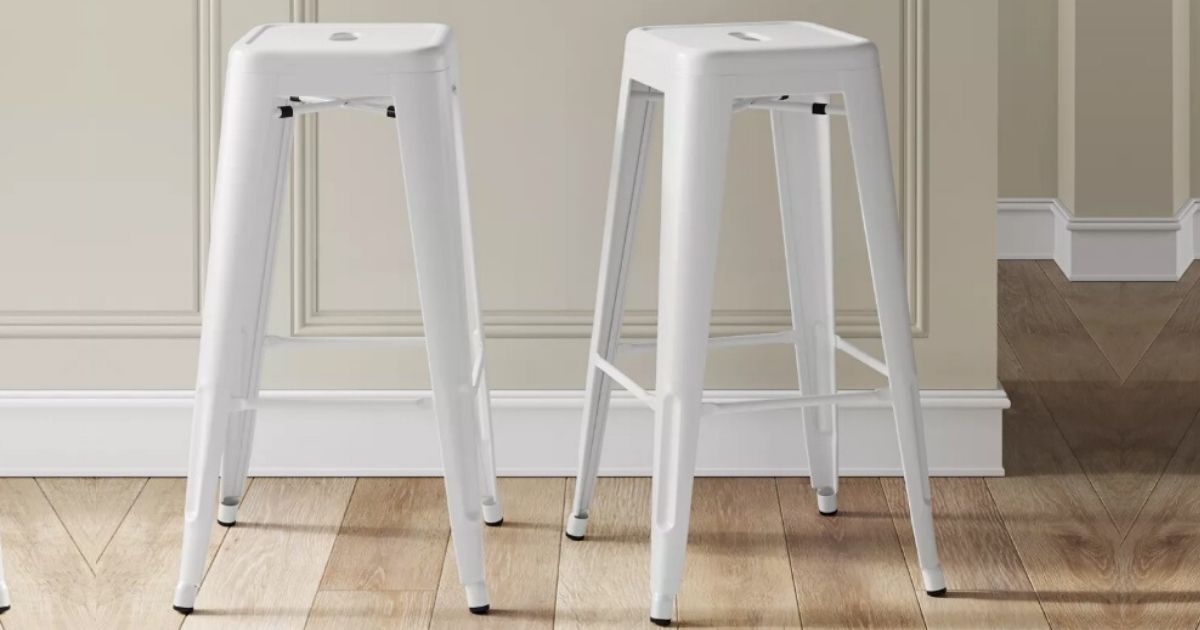 two metal barstool next to countertop