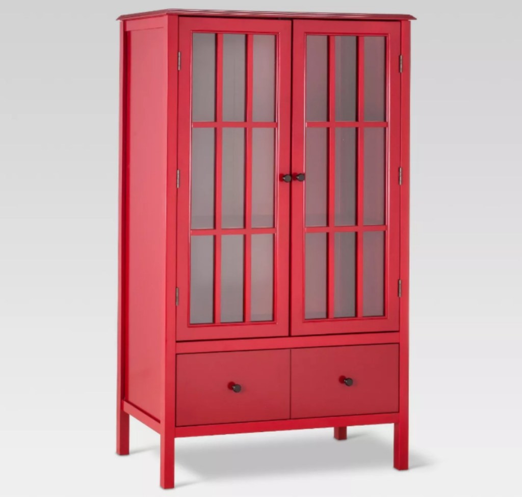 tall red storage cabinet with glass panel doors