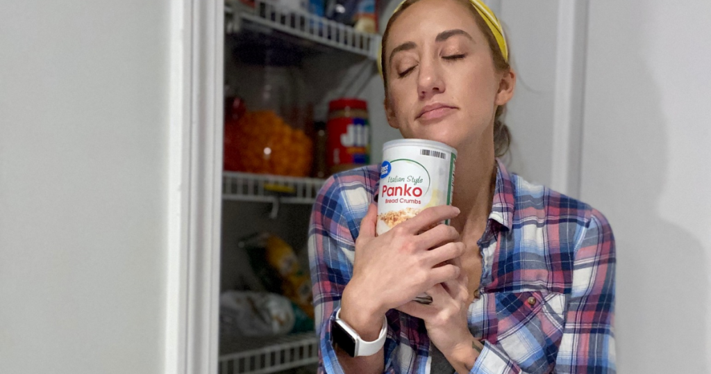 Woman standing in front of pantry holding Panko bread crumbs