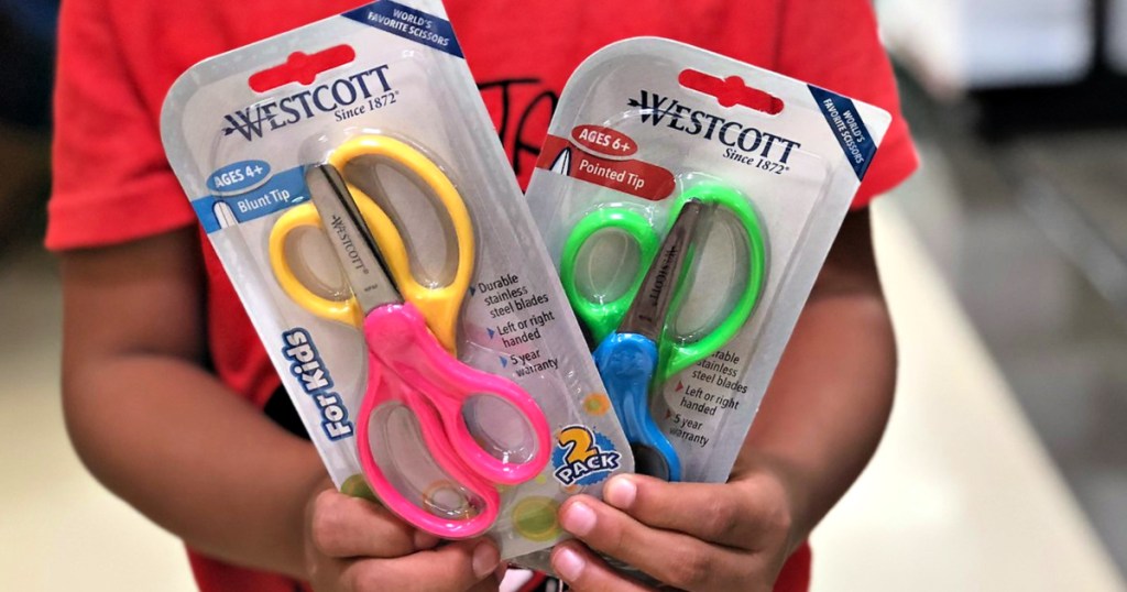 two packs of westcott 2-pack kids scissors in child's hands