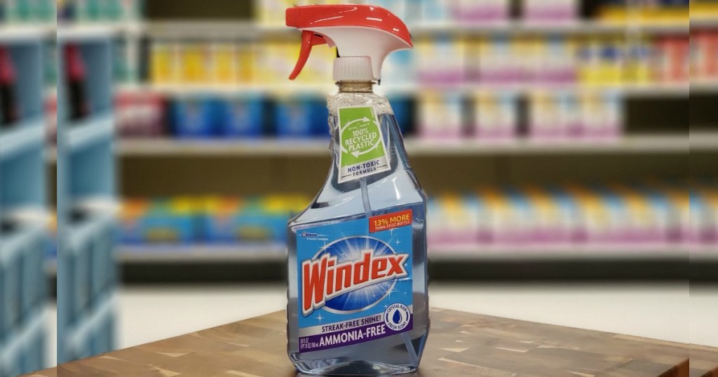 a bottle of Windex Ammonia Free Glass Cleaner sitting on a wood shelf in grocery store