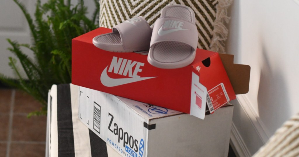 sandals on top of shoe box and delivery box in house
