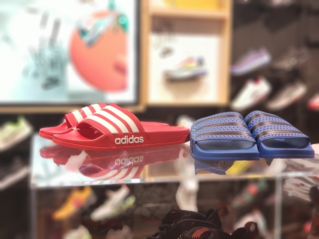 pink and blue adidas slides in-store