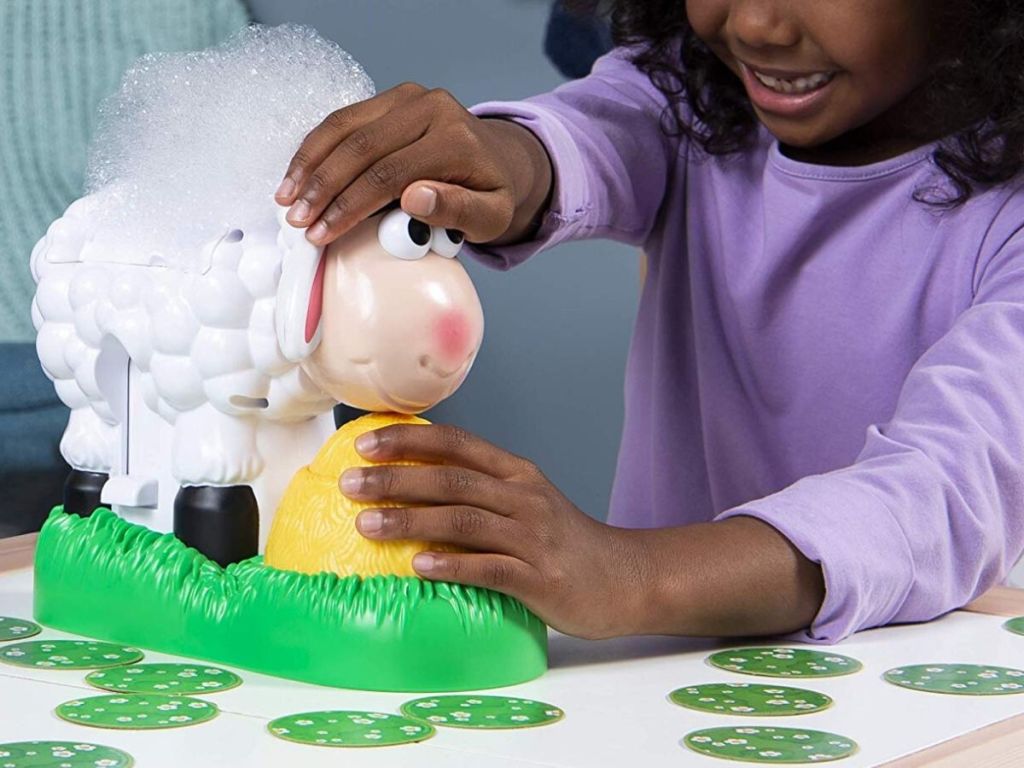 little girl playing with bubble blowing sheep game