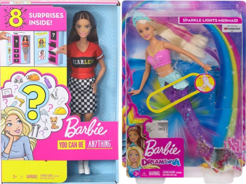 two Barbie dolls in the packaging boxes
