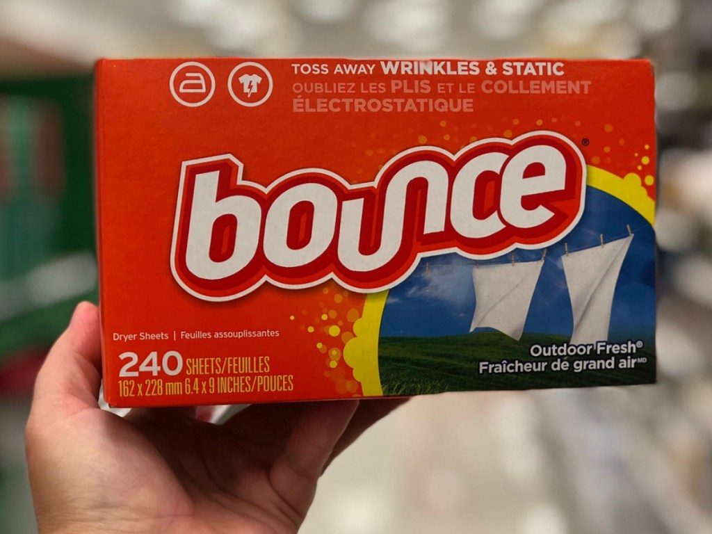 hand holding package of fabric softener sheets in store