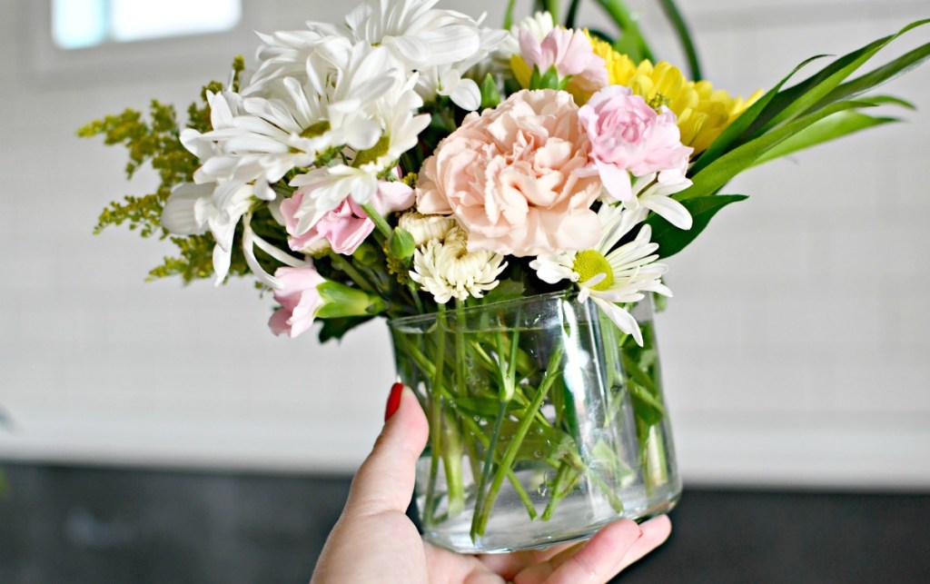 bath and bodyworks candle jar used as a vase