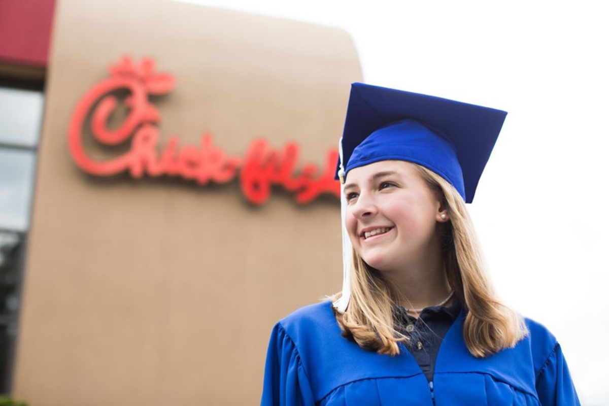graduate standing outside Chick-fil-A