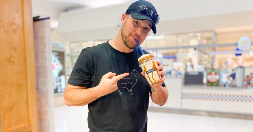 man drinking shake from a straw