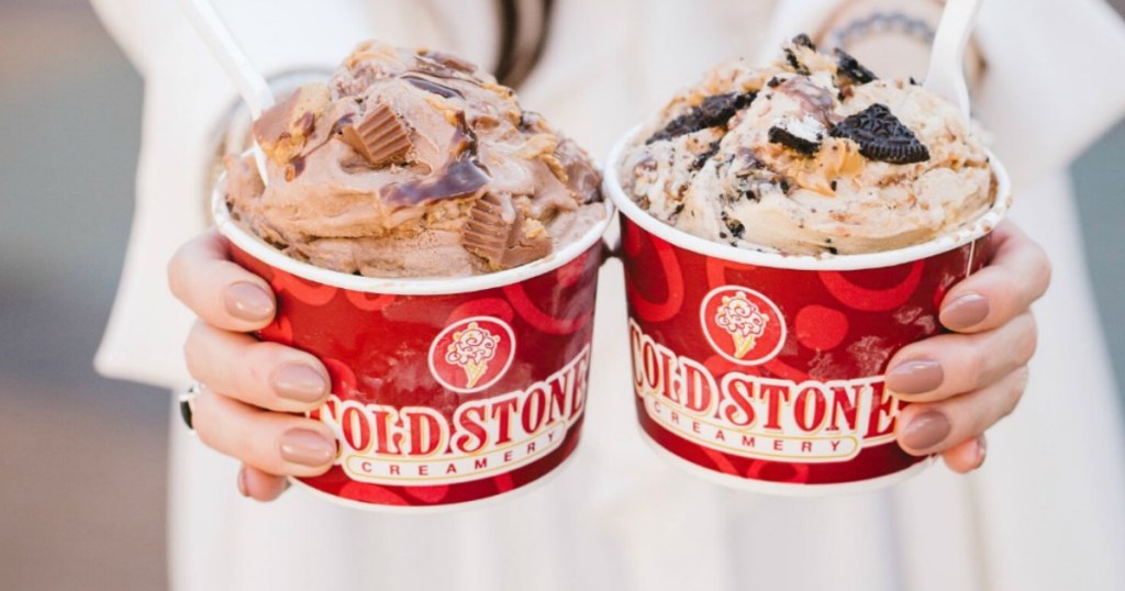 person holding two coldstone creamery cups