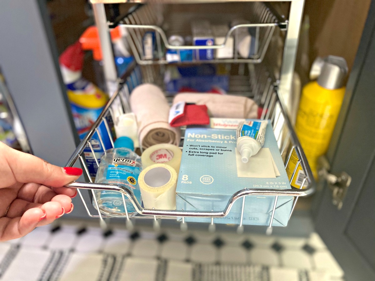 first aid items in a cabinet drawer organizer