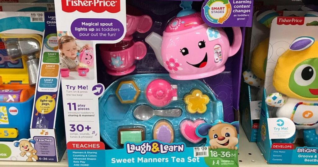 store shelf with fisher price toys at store with main focus on kids tea pot set