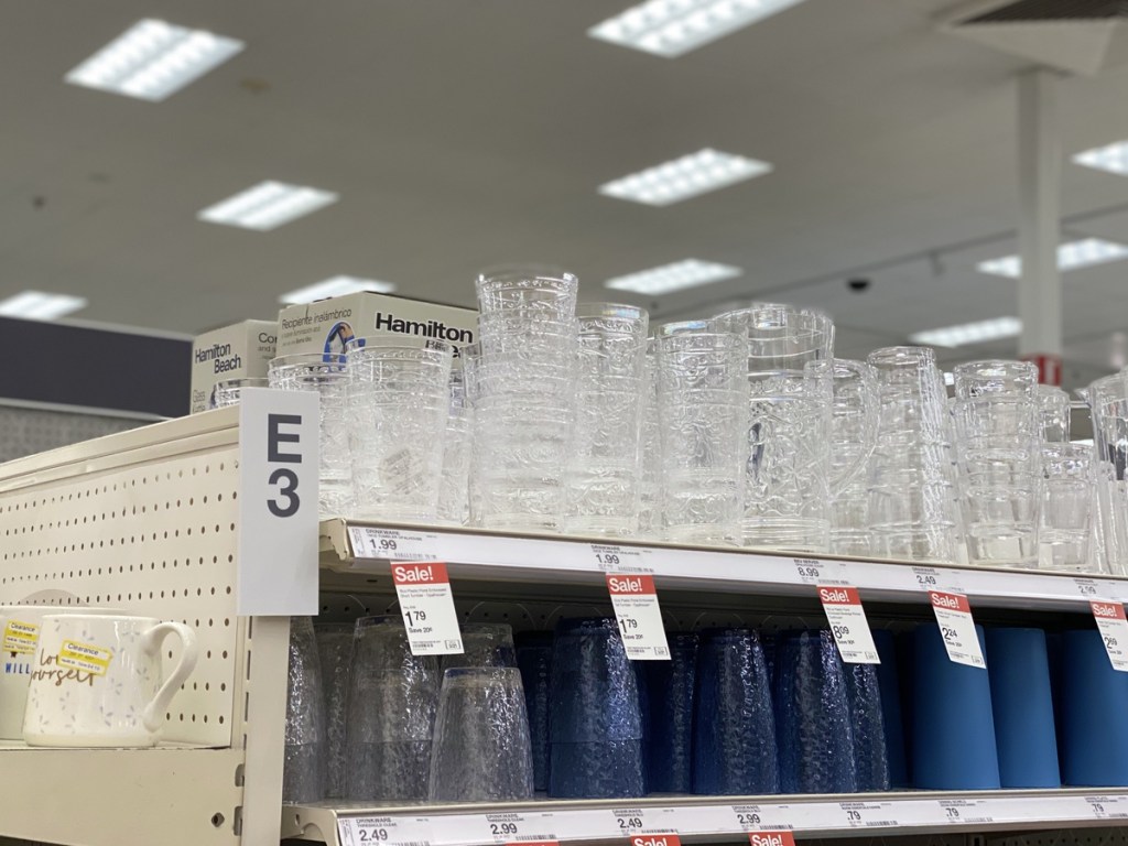top shelf of a store holding plastic tumblers