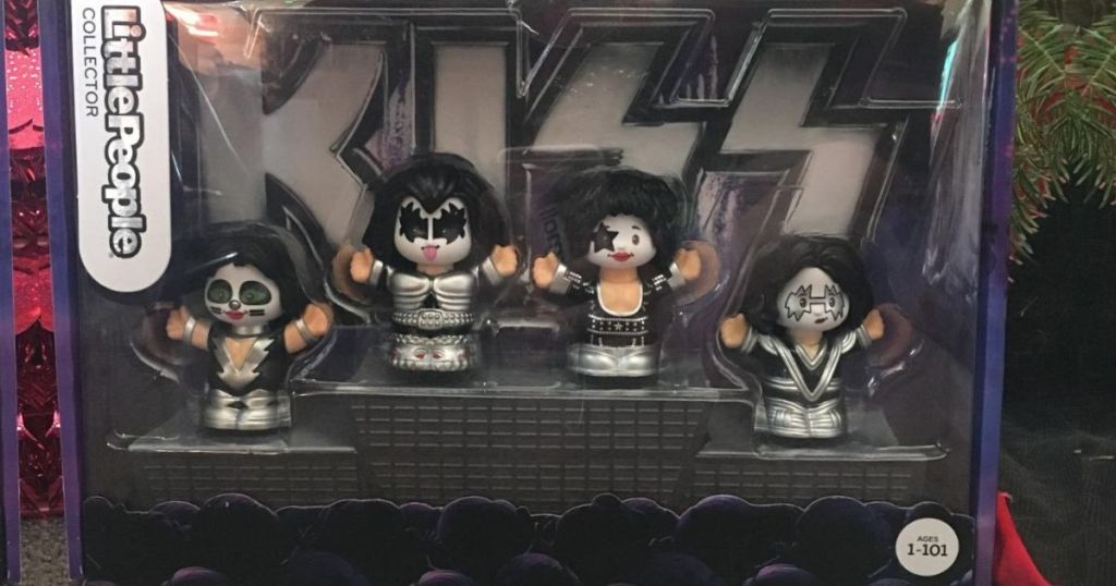 box containing four plastic figures designed in the likeness of the band kiss
