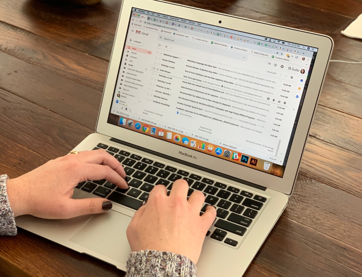 woman's hand typing on Macbook