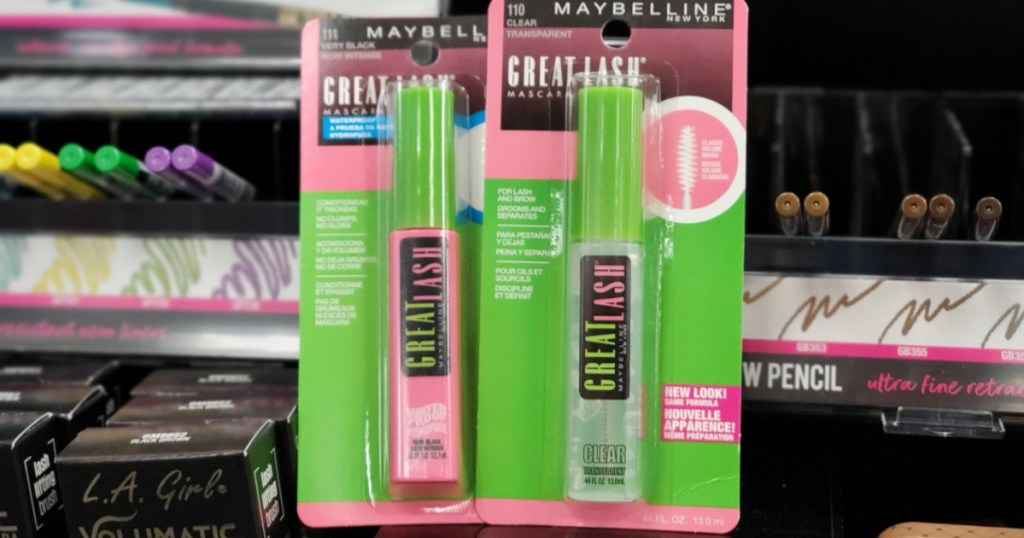 hand holding 2 maybelline mascara products 