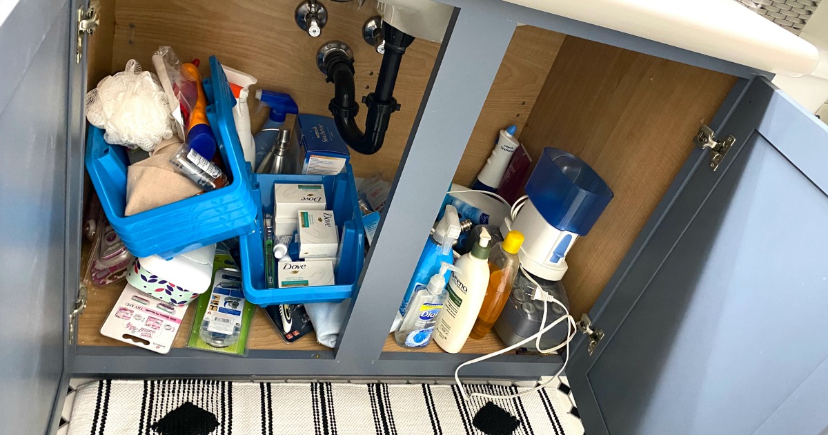 messy bathroom cabinet before organizing 