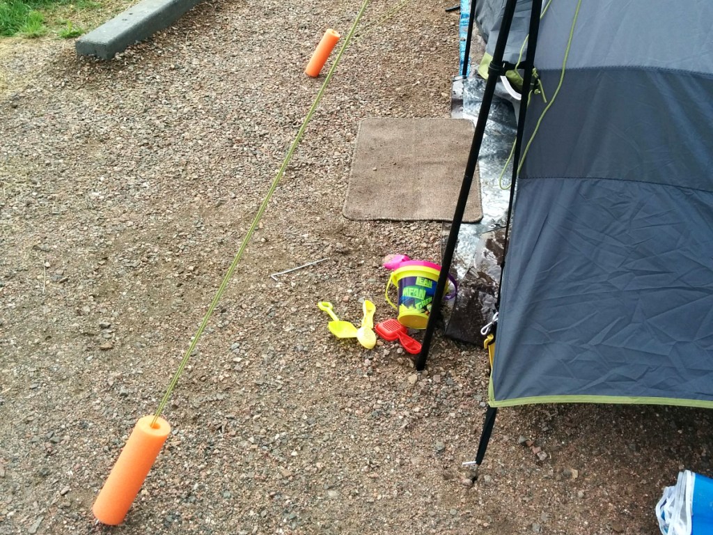 camping hacks - pool noodles on tent lines