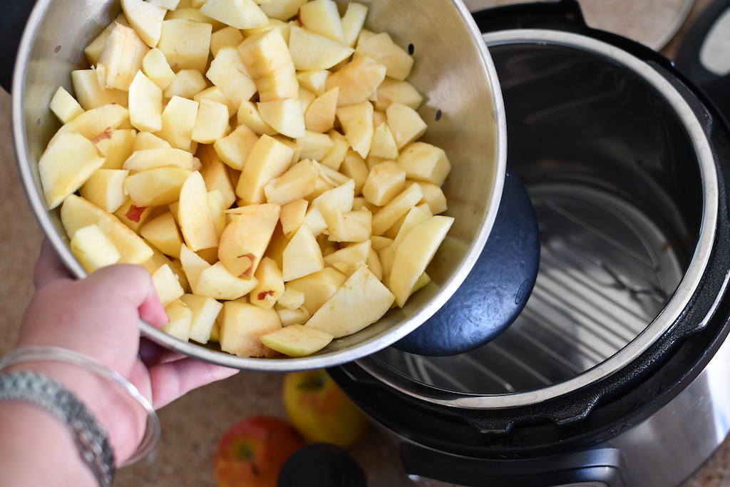 sliced up apples in bowl, about to put in Instant Pot