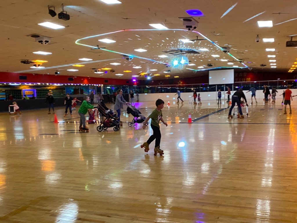 kids roller skating at an indoor rink