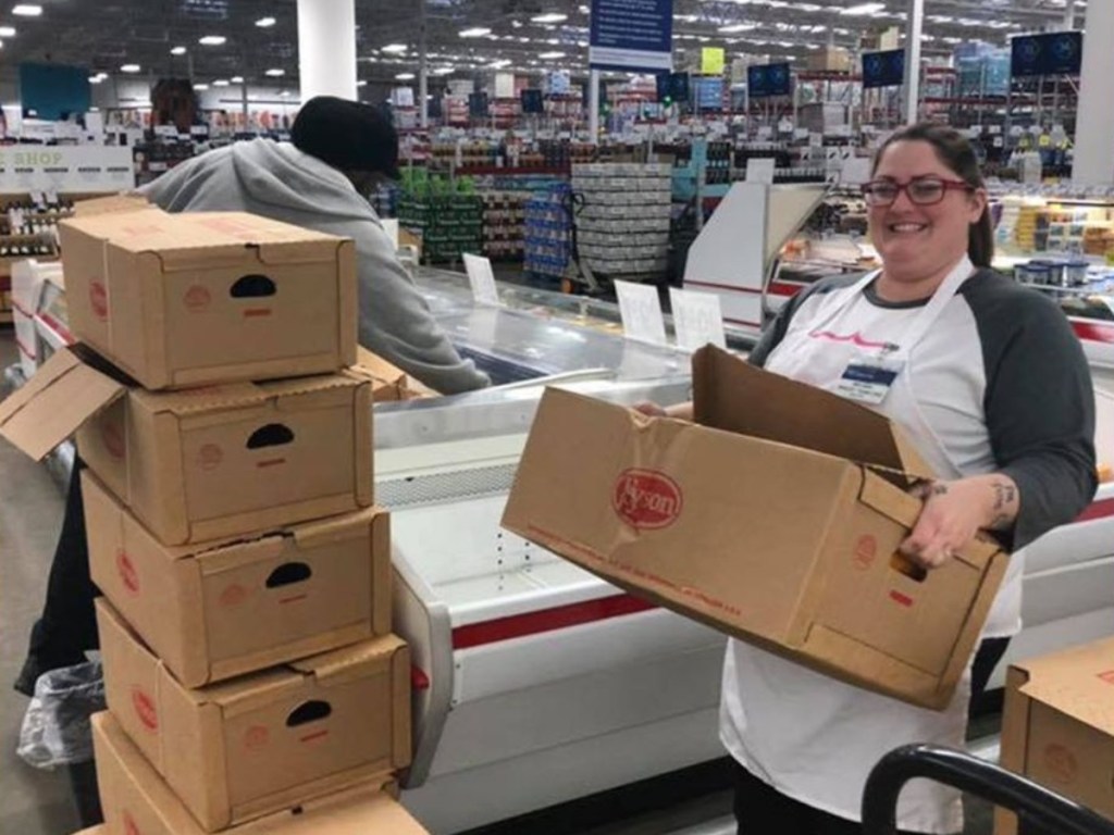 Sam's Club employees with boxes