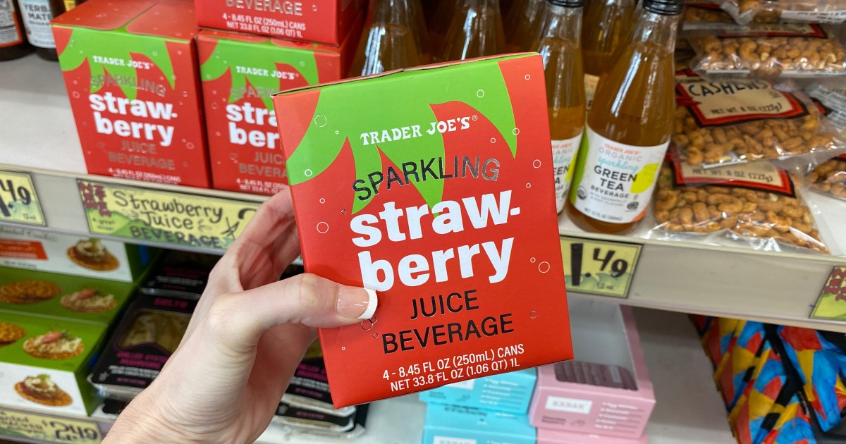 hand holding 4-pack of Sparkling Strawberry Juice