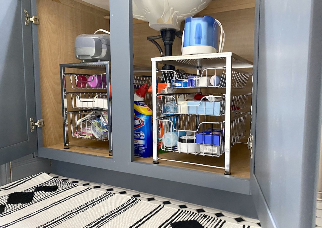 two stainless steel chrome bathroom organizers under sink