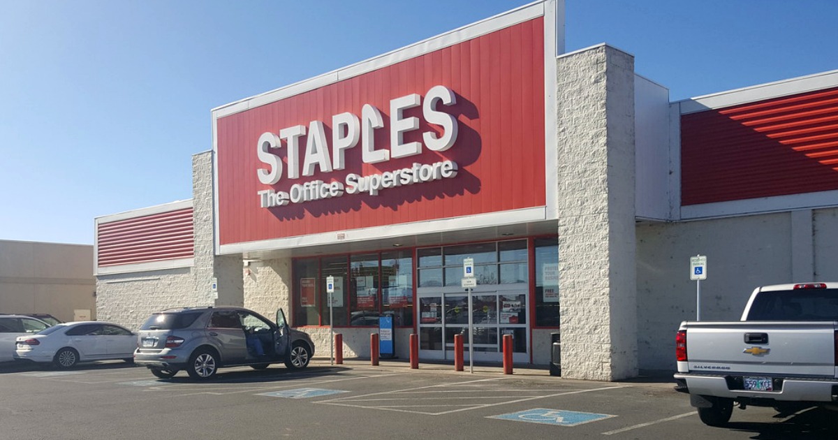 staples store front with cars outside