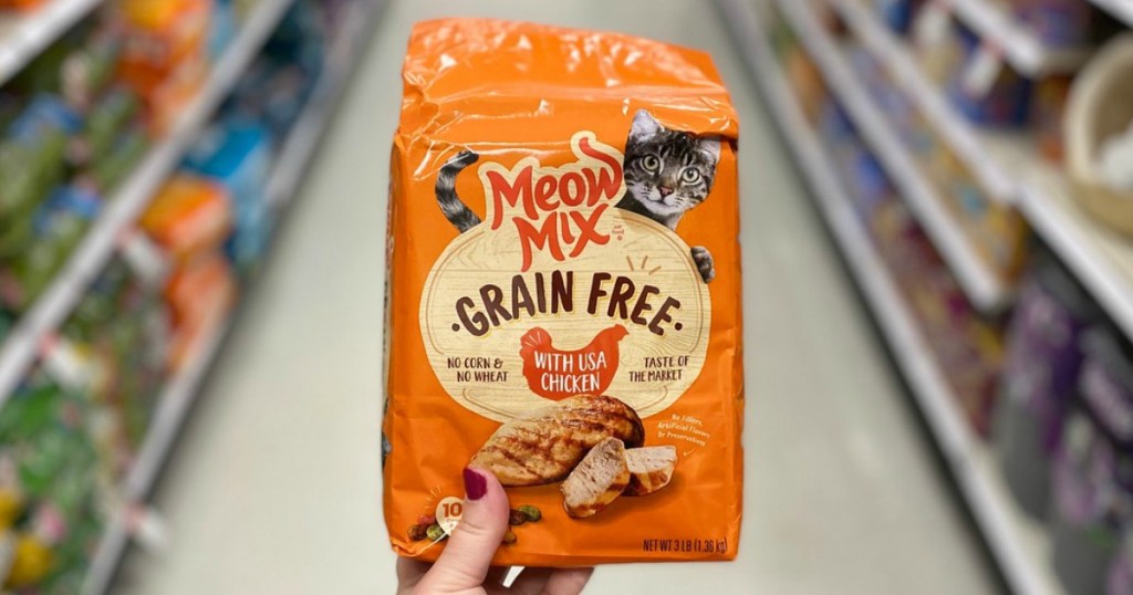 hand holding a bag of cat food in a store