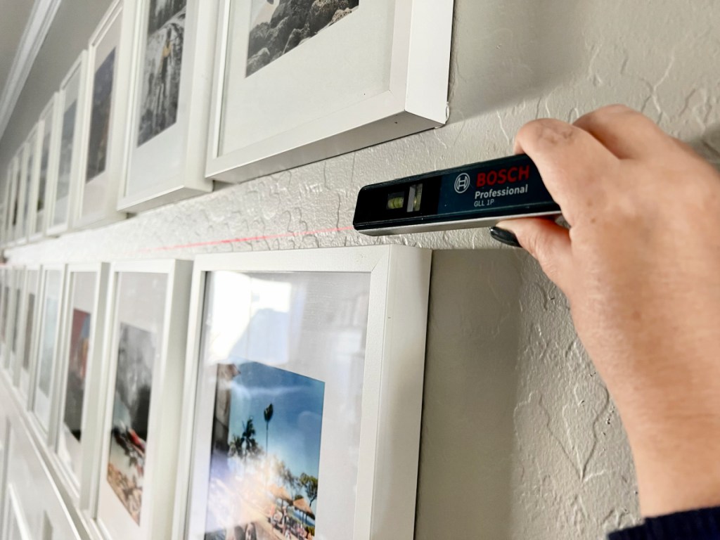 using a laser level to hang a gallery wall