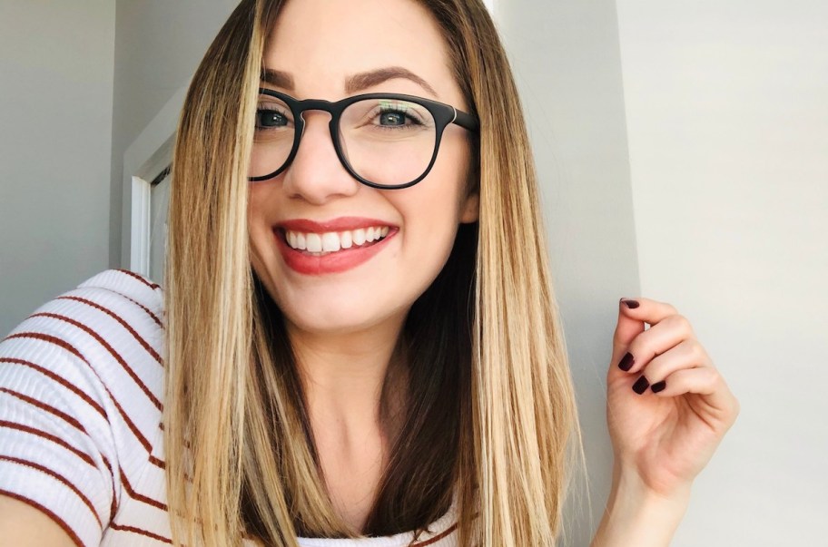 close up of woman wearing warby parker glasses