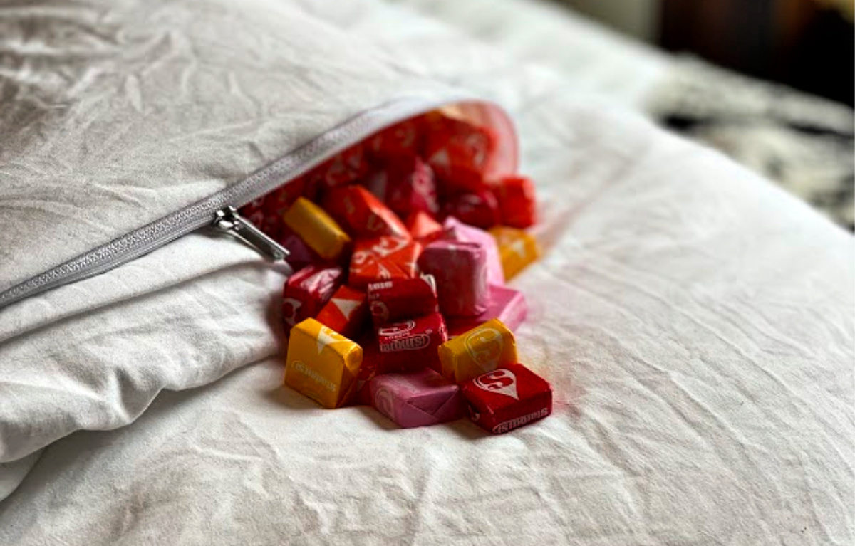 white blanket filled with starbursts candy