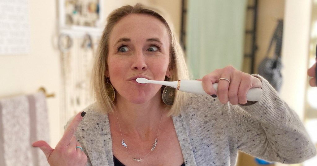 woman brushing her teeth