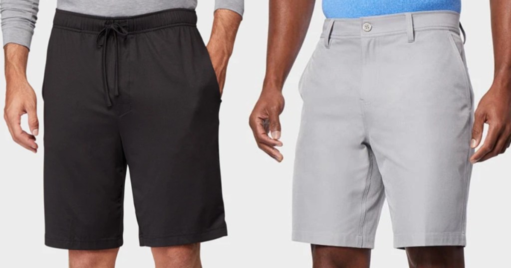 two men standing next to each other wearing shorts hands on their sides