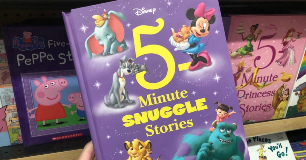 disney themed story book in hand near in-store display