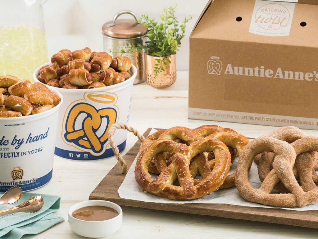 Pretzels on cutting board at home next to dipping sauces