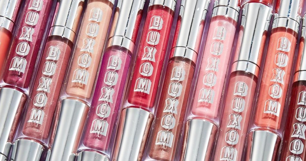 multiple tubes of buxom brand lip glosses in pink shades