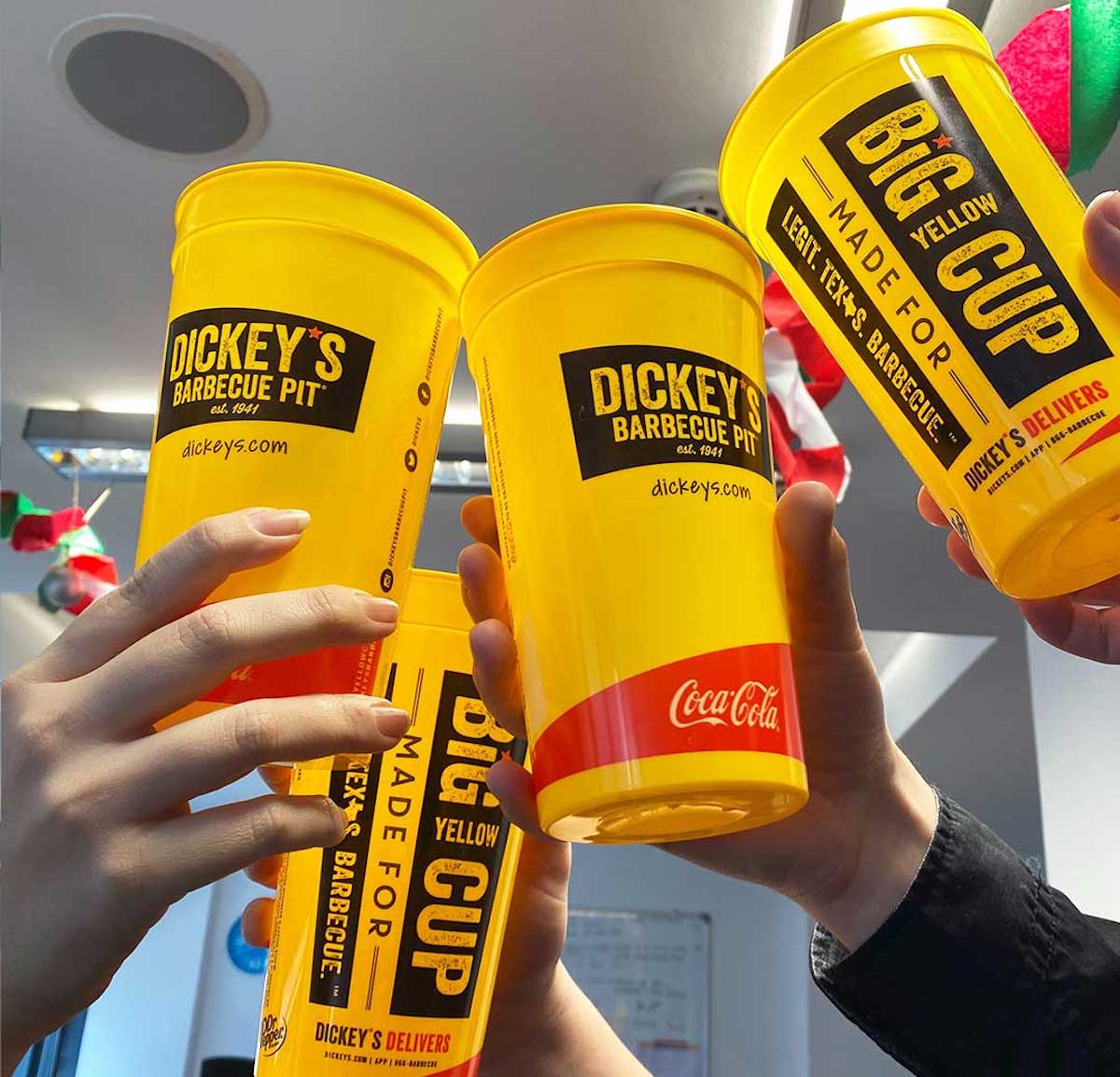 four dickey's barbecue pit cups being toasted in store