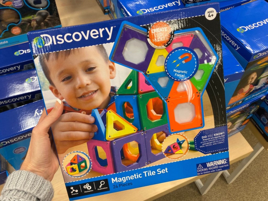hand holding kids tile toy set in store
