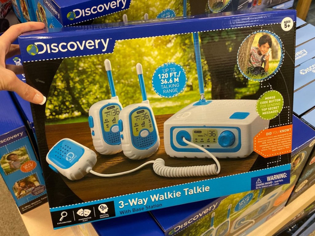 hand holding walkie talkie toy set in store