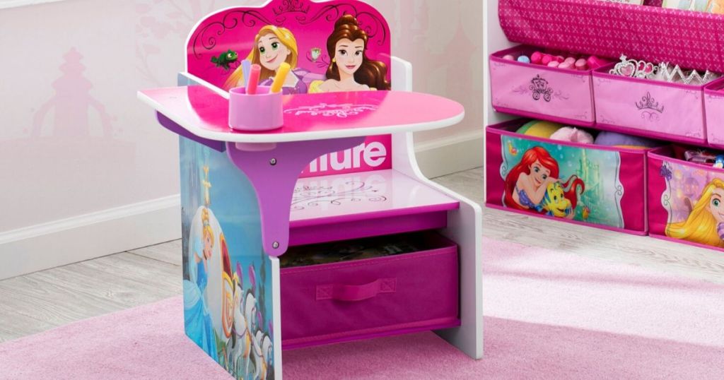 Disney Princess Chair Desk on Carpet in front of disney toy box