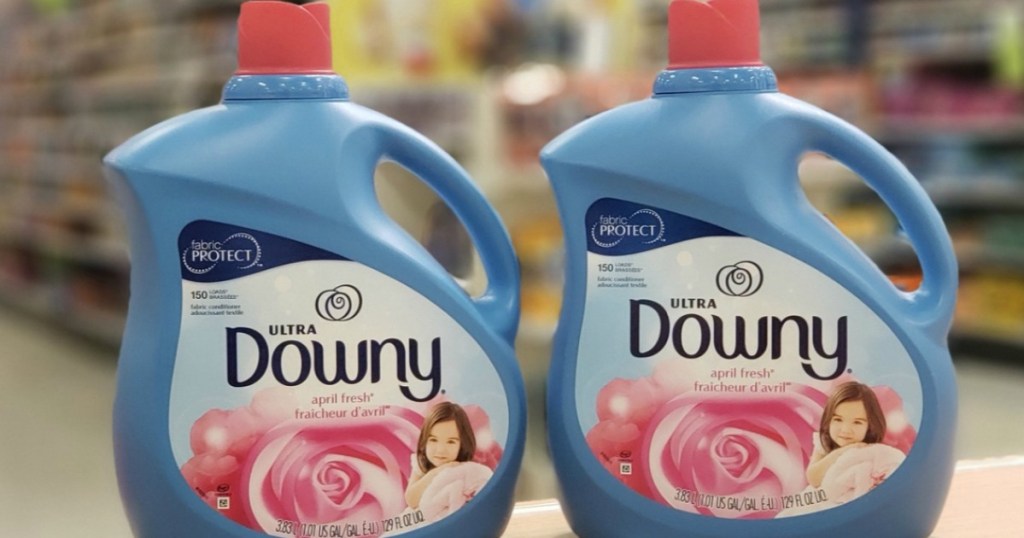two bottles of Downy Ultra on counter at a store