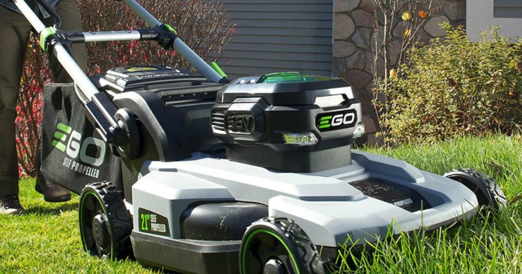 man pushing a lawn mower