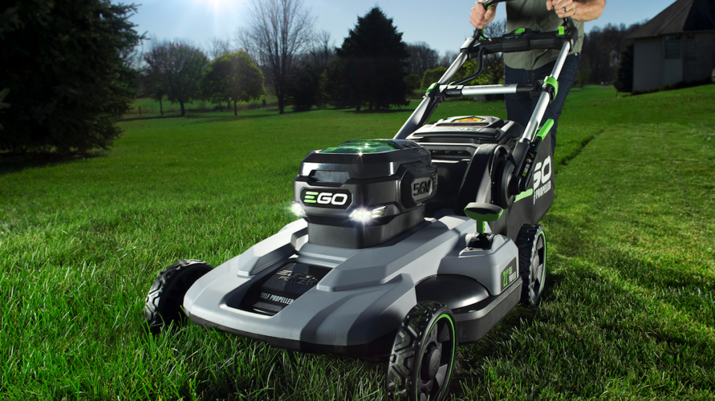 person pushing a lawn mower