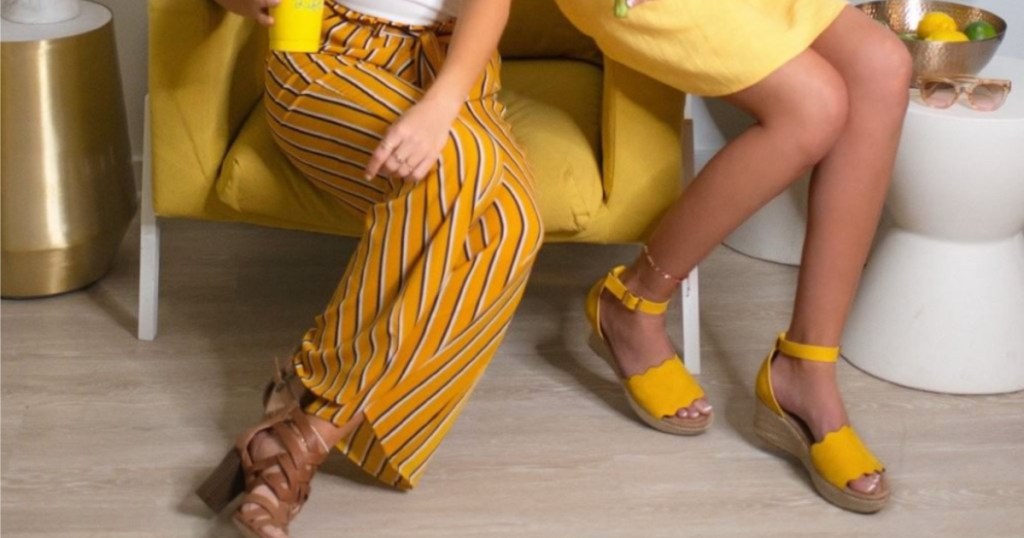 woman wearing stripe yellow pants sitting down