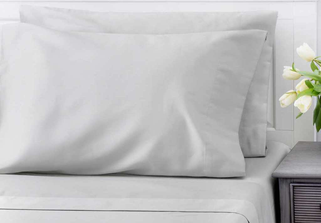 pillows and sheets on a bed