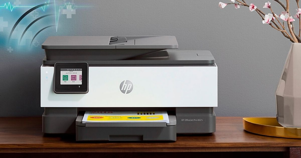HP Printer next to vase with flowers