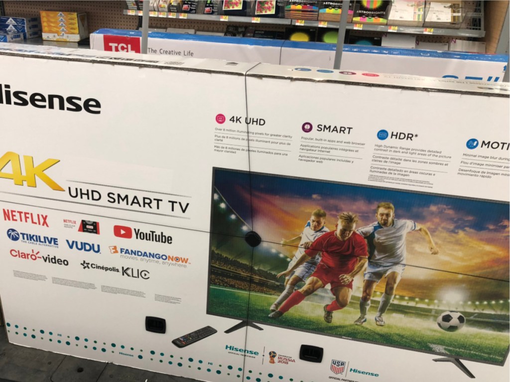 huge tv box on floor in store aisle