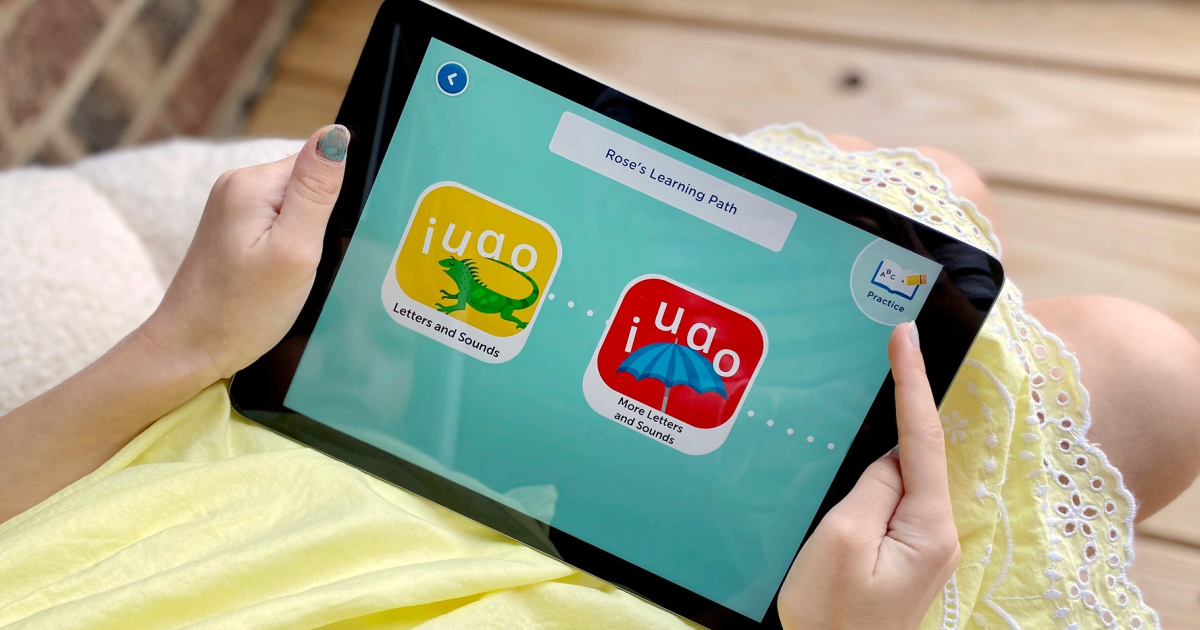 Little girl holding ipad Homer App